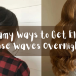 A horizontal hair styling graphic consisting of two separate portrait panels, as referenced in the file 5 Dreamy Ways to Get Elegant Loose Waves Overnight.jpg. Overlaid across the exact center of both images is a wide, semi-transparent charcoal-grey banner displaying the white handwritten-style title: "5 Dreamy ways to Get Elegant Loose waves Overnight". The panels include: Left Panel: A rear view of a woman with her dark brunette hair elegantly gathered into a low, smooth bun accent with a delicate gold decorative hair fork. She is wearing a red and black buffalo plaid flannel shirt. Right Panel: A side profile view of a woman showcasing long, thick red hair styled into structured, glossy vintage waves that cascade down her back. She wears a sheer white lace or polka-dot blouse.