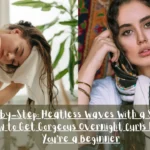 A side-by-side split image showcasing heatless wave preparation and protection. The left panel shows a woman leaning forward while gently drying her wet hair with a white towel. The right panel shows a woman with dark wavy hair framing her face, wearing a patterned silk scarf tied around her head. Across the bottom, a semi-transparent dark banner features white text reading: "Step-by-Step: Heatless Waves with a Silk Scarf - How to Get Gorgeous Overnight Curls Even If You're a Beginner."