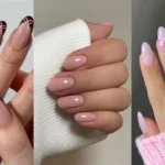 A three-panel collage displaying coquette nail art styles. Left image shows almond nails with burgundy French tips and white bow details; center shows short glossy strawberry milk pink nails against a white knit sleeve; right panel shows light pink almond gel nails featuring 3D pink bow charms and gold rings.