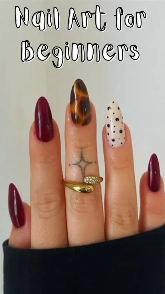 A hand showing long oval nails with diverse designs including dark burgundy polish, tortoise shell pattern, and black polka dots on cream, with overlay text reading "Nail Art for Beginners".